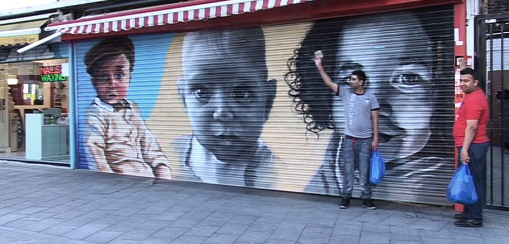 Round, cute baby faces painted on the shop shutters decreased the crime rate during the 2011 Greenwich riots.